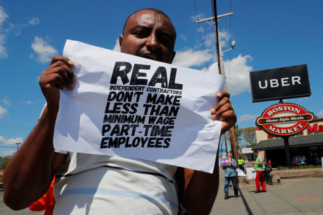 Uber and Lyft drivers protest during a day-long strike outside Uber's office in Saugus, Massachusetts, U.S., May 8, 2019.   REUTERS/Brian Snyder